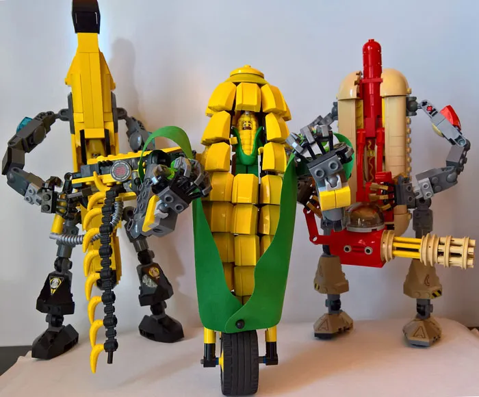 LEGO builds featuring detailed models of a banana, corn on the cob, and hot dog with mechanical arms and legs.