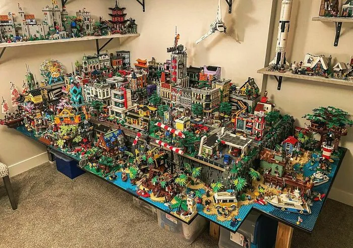 Intricate LEGO builds displaying a detailed cityscape and beach scene, showcasing incredible LEGO art and creativity.