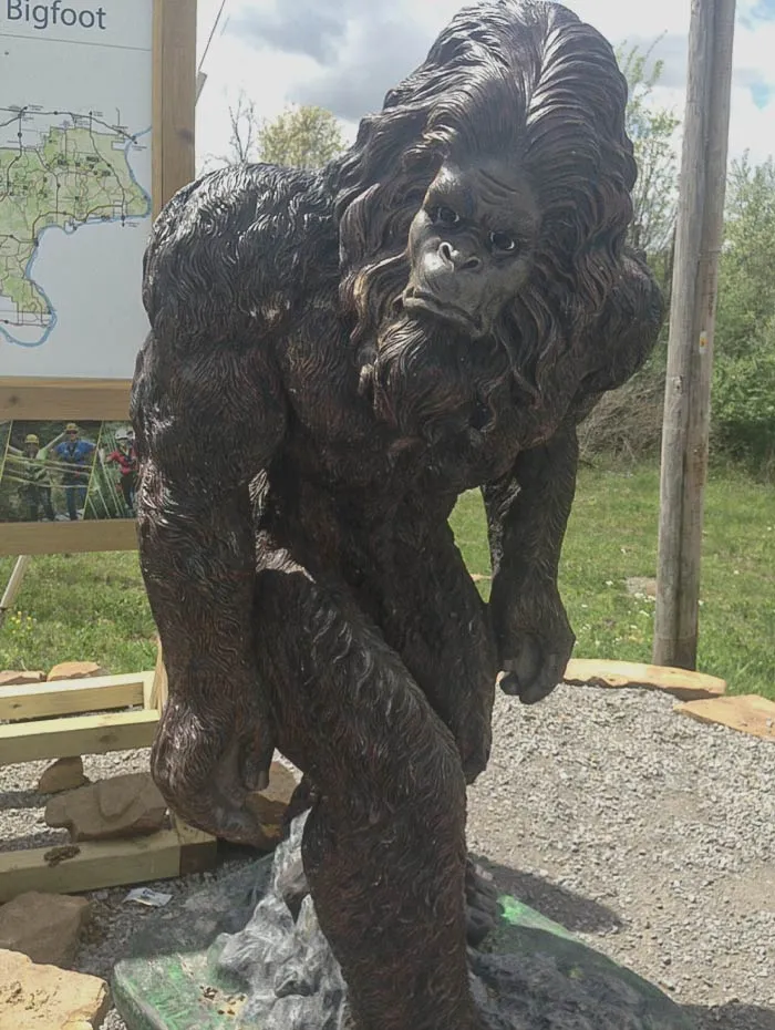 Statue of Bigfoot in a park 