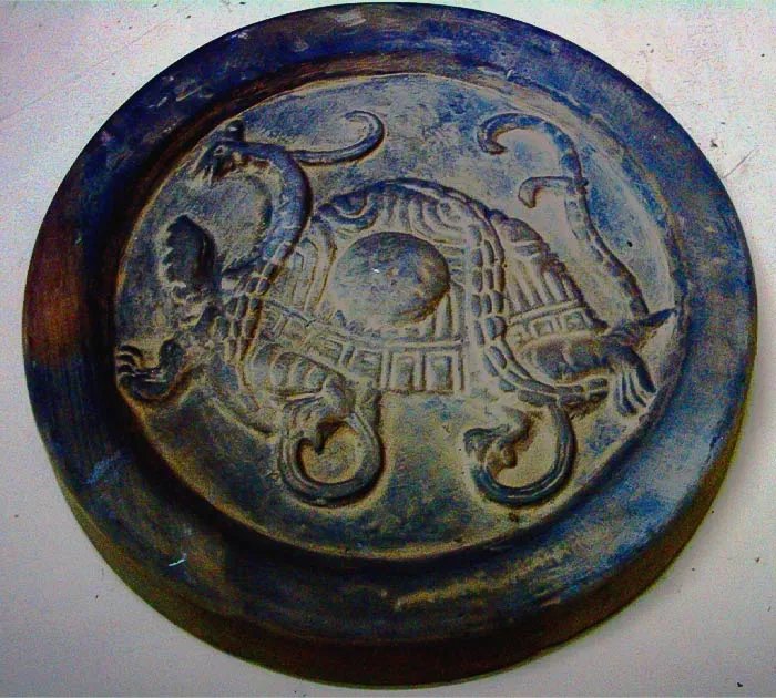 Engravings of a Black Tortoise on a rock 