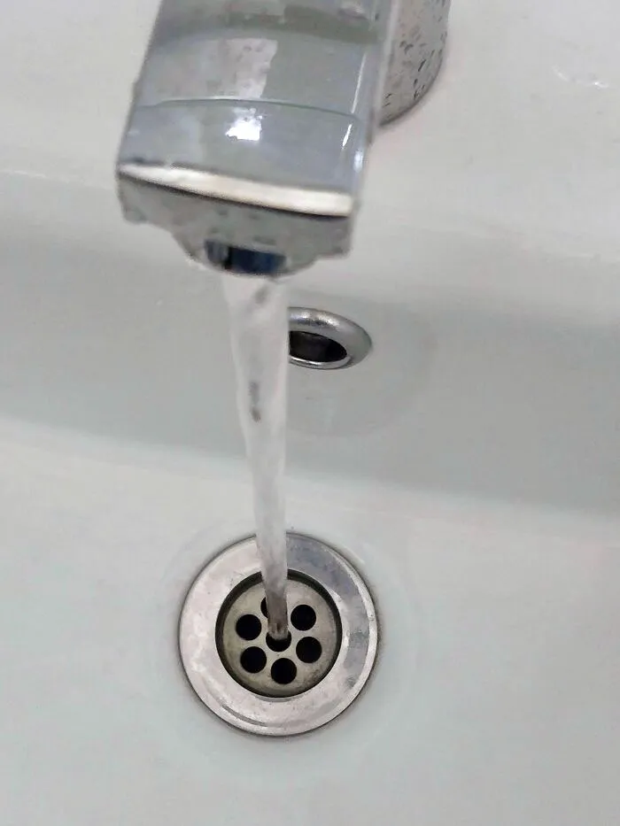 Water From The Faucet In My Office's Bathroom Goes Straight Through The Middle Of The Sink Drain