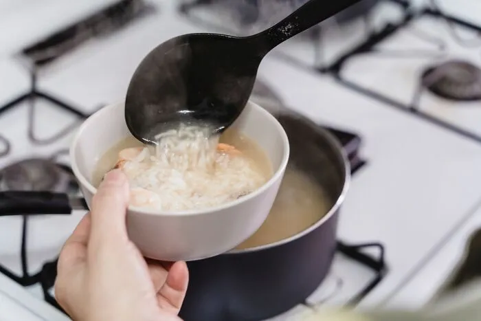 Filling Up Soup Pot With Fresh Homemade Soup 