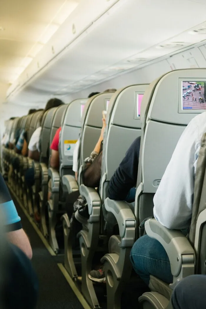 Planes Inside And People Sitting In Their Seats 