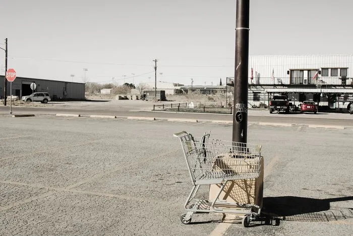 Shopping Cart Left Near The Lamp Post 