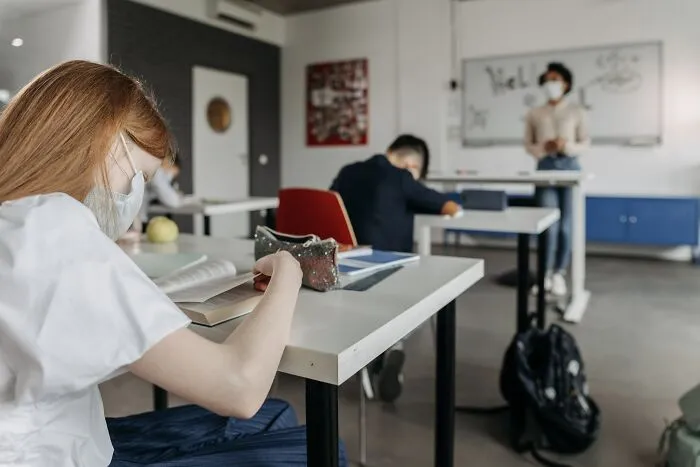 People In Class Room With Face Masks 