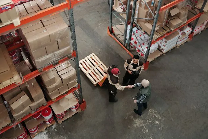 Coworkers Talking In The Warehouse 