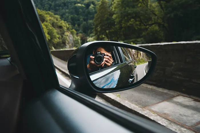 Person pictures reflection of himself