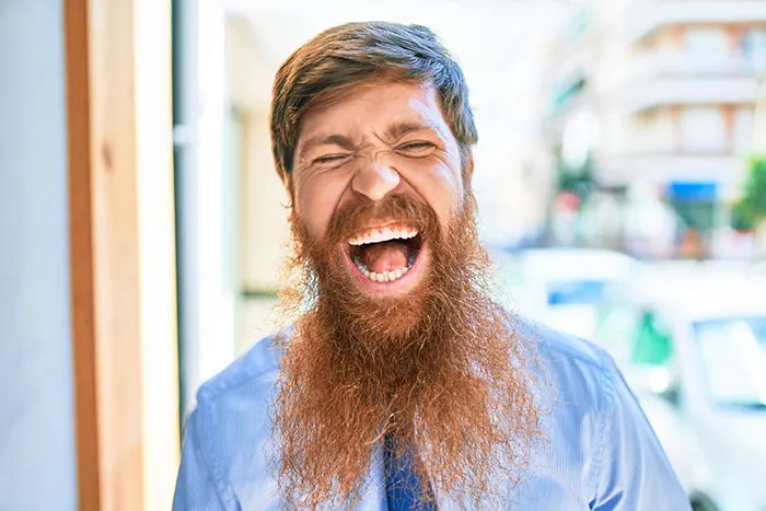 Man wearing blue shirts and screaming