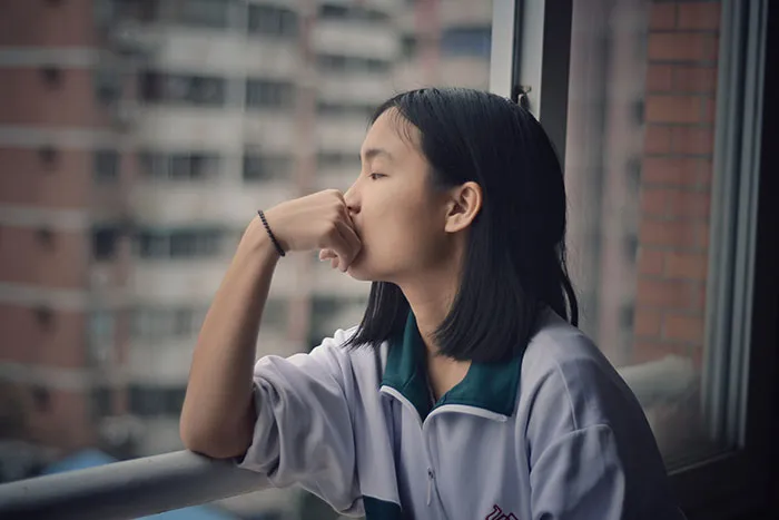 Person looking through the window