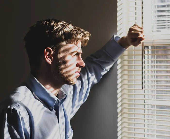 Person looking through the window