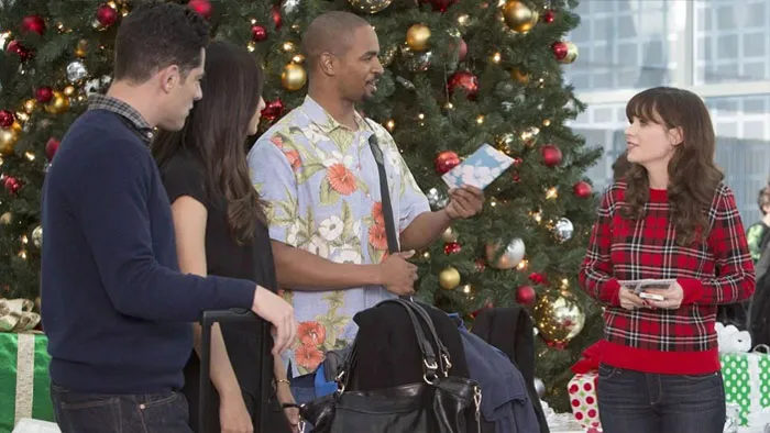 Coach holding a Christmas card 