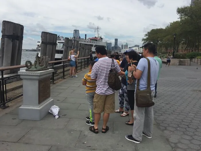 My Family Leaves A Bouquet Of Flowers At The Monument