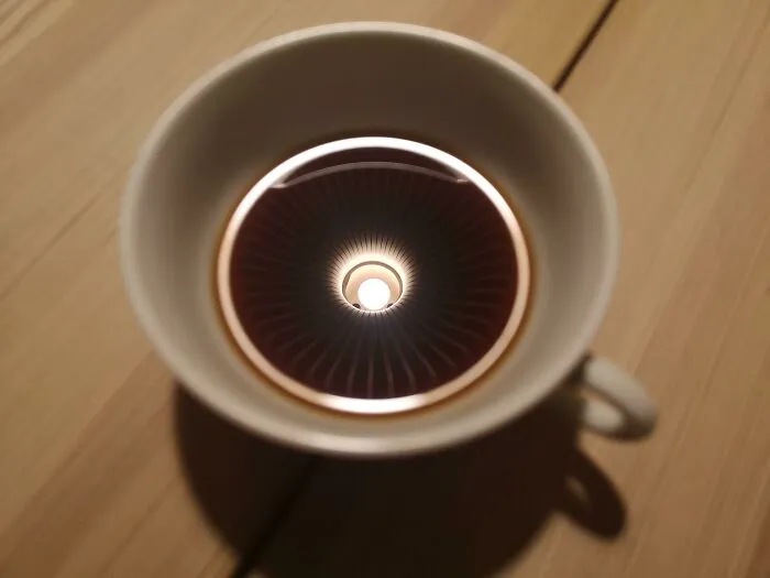ITAP Of My Coffee Cup With The Reflection Of A Lamp