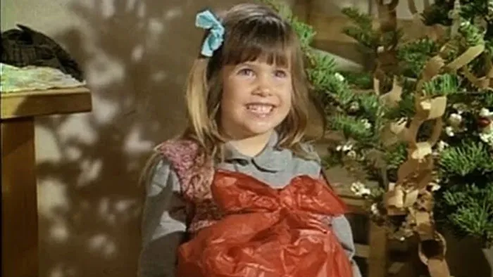Laura holding a present 