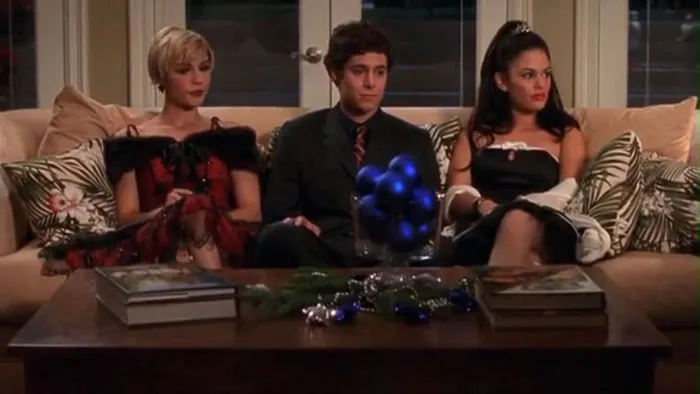 Marissa, Seth and Summer sitting on the couch 
