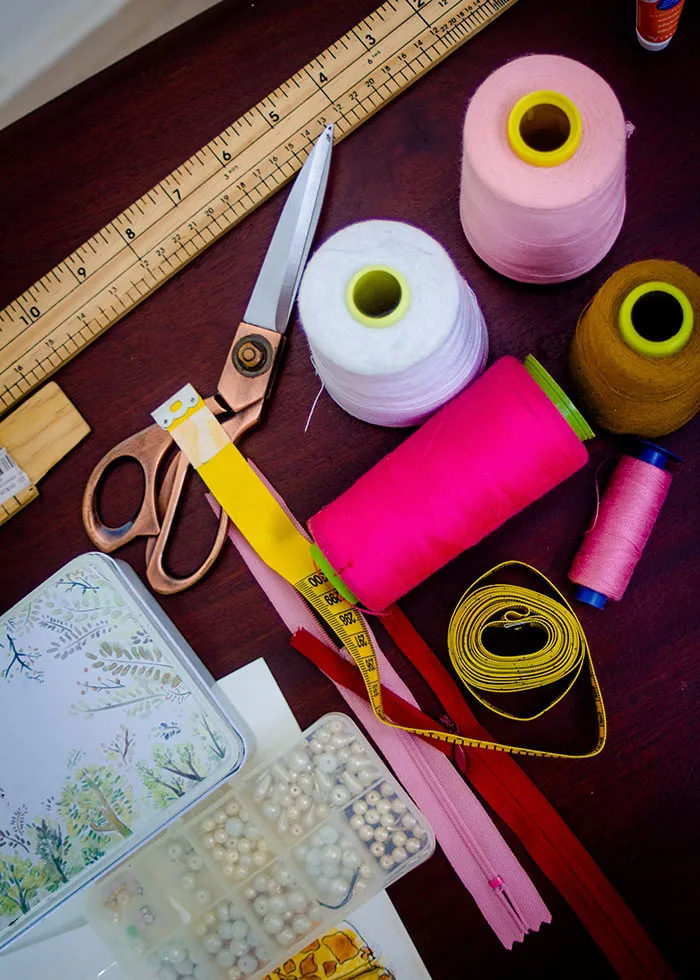 Threads, ruler, and scissors on a table, perfect for me-time crafting activities.
