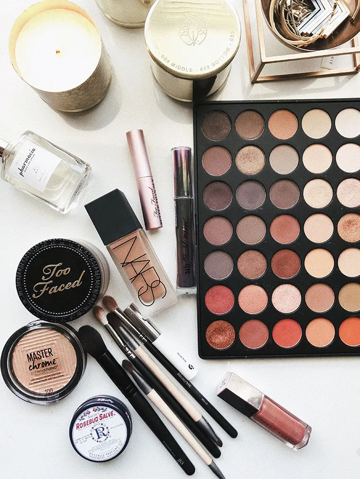 Makeup collection for a solo beauty session, featuring brushes, palettes, and skincare essentials for a perfect "me time".
