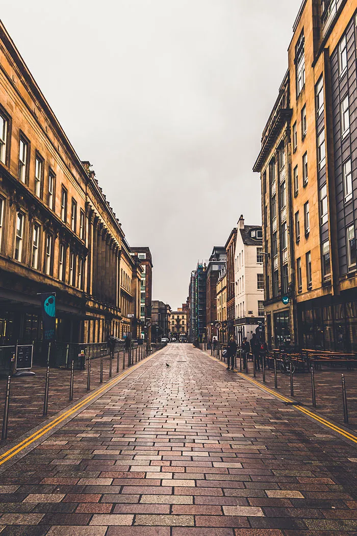 Urban street lined with buildings, perfect for solo exploration and enjoying "me time."