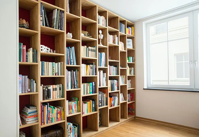 Bookshelf filled with books, perfect for enjoying "me time" and exploring new ideas alone.