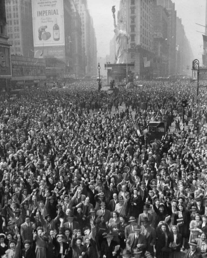 A Crowd In Time Square, New York City Celebrating The Surrender Of Germany In World War 2. This Photo Was Taken On May 7th, 1945
