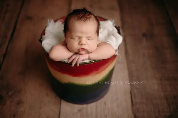 Baby In Rainbow Bucket
