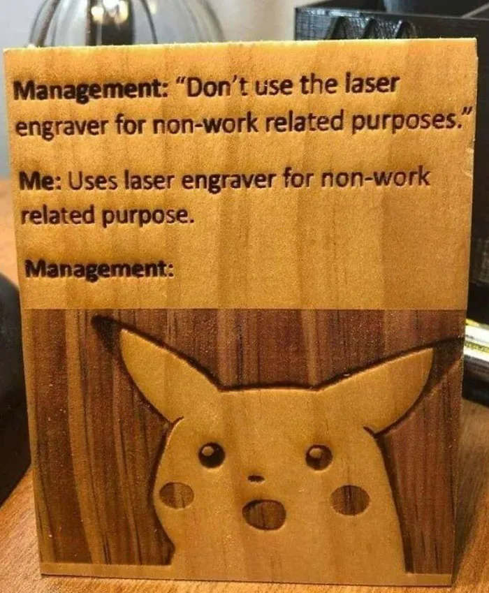 Wholesome meme: A wooden plaque with surprised Pikachu engraving, a humorous take on workplace rules.