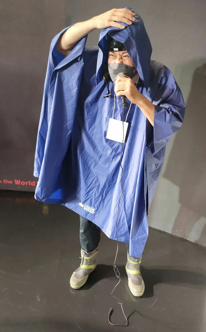 TV Newscaster Reporting On A Typhoon