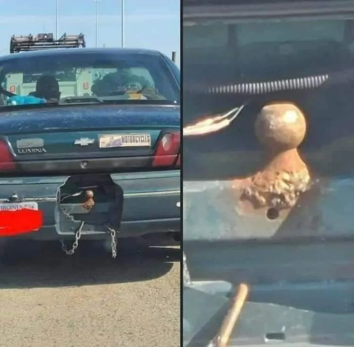 Car with a makeshift tow hitch secured by chains, highlighting disregard for OSHA safety regulations.
