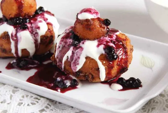 Papanași! A Delicious Doughy Dumpling/Doughnit Made With Soft Cheese,  Served With Jam And Cream, From Romania And Moldova