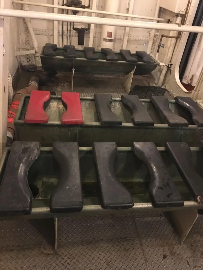 Head (Ship’s Restroom) Of Navy Destroyer Uss Kidd That Sailed From 1943 To 1967. One Seat Is Painted Red: This Was Called The "Hot Seat" And It Was Reserved For Crew Who Had Sexually Transmitted Diseases