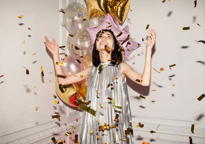 woman popping the confetti