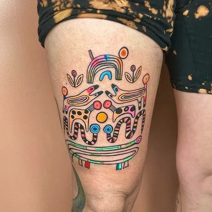 Trippy tattoo featuring colorful abstract figures on a leg, showcasing psychedelic art style.