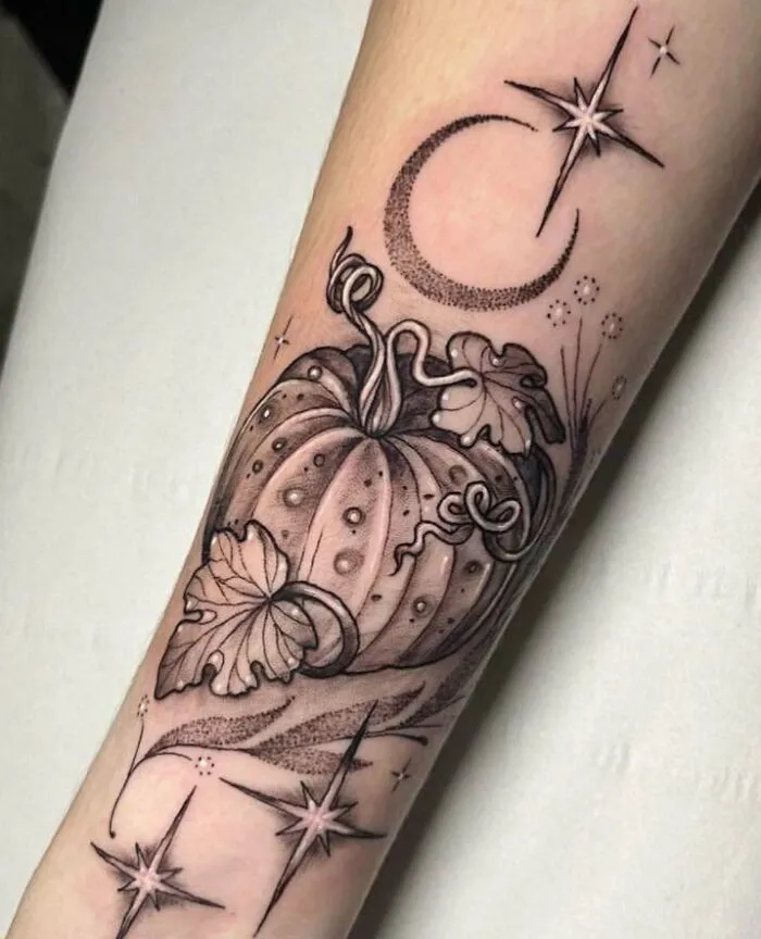 Psychedelic art tattoo featuring a stylized pumpkin, crescent moon, and stars on a forearm.