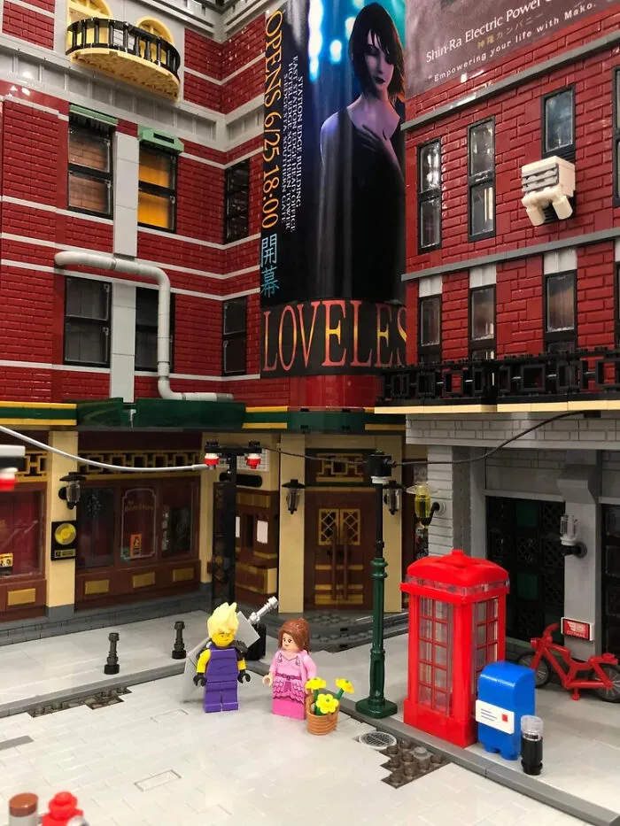 Intricate LEGO builds of an urban street scene with minifigures, a red phone booth, and detailed brick buildings.