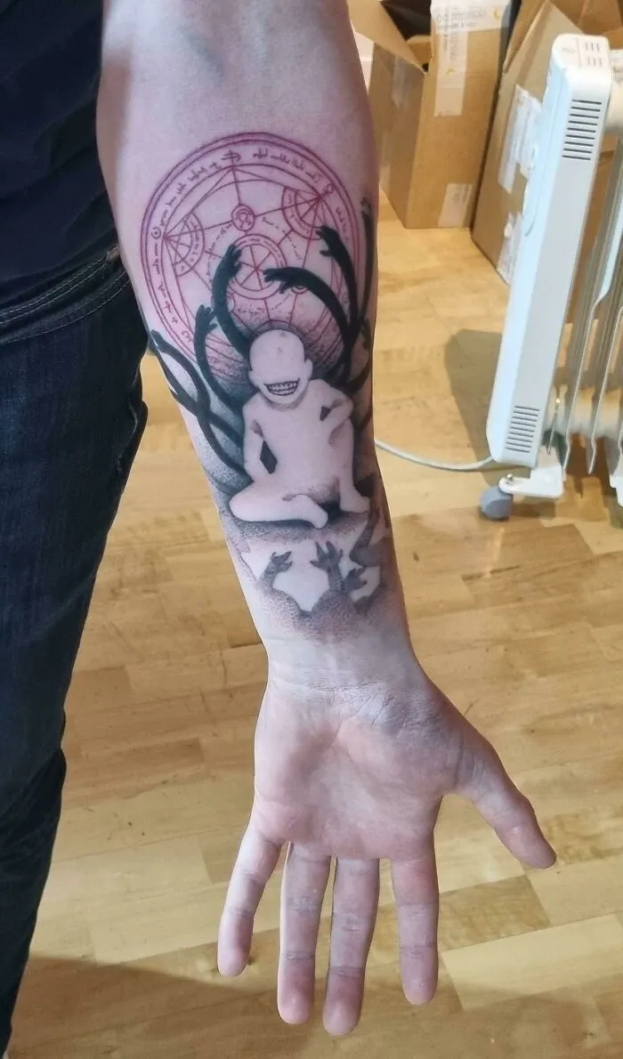 Trippy tattoo featuring Full Metal Alchemist arm design, with a detailed alchemical symbol and abstract elements.
