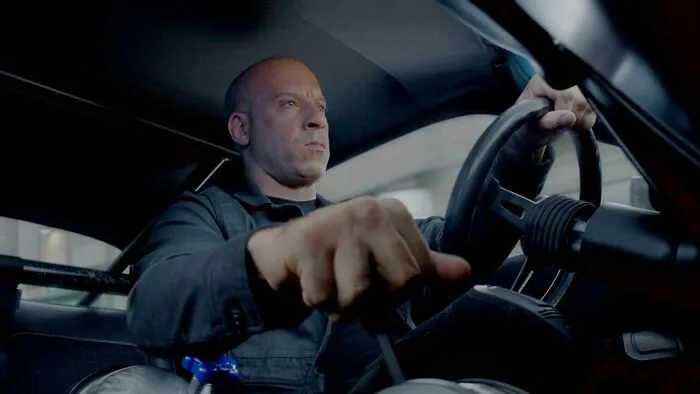Vin Diesel angry and driving a car