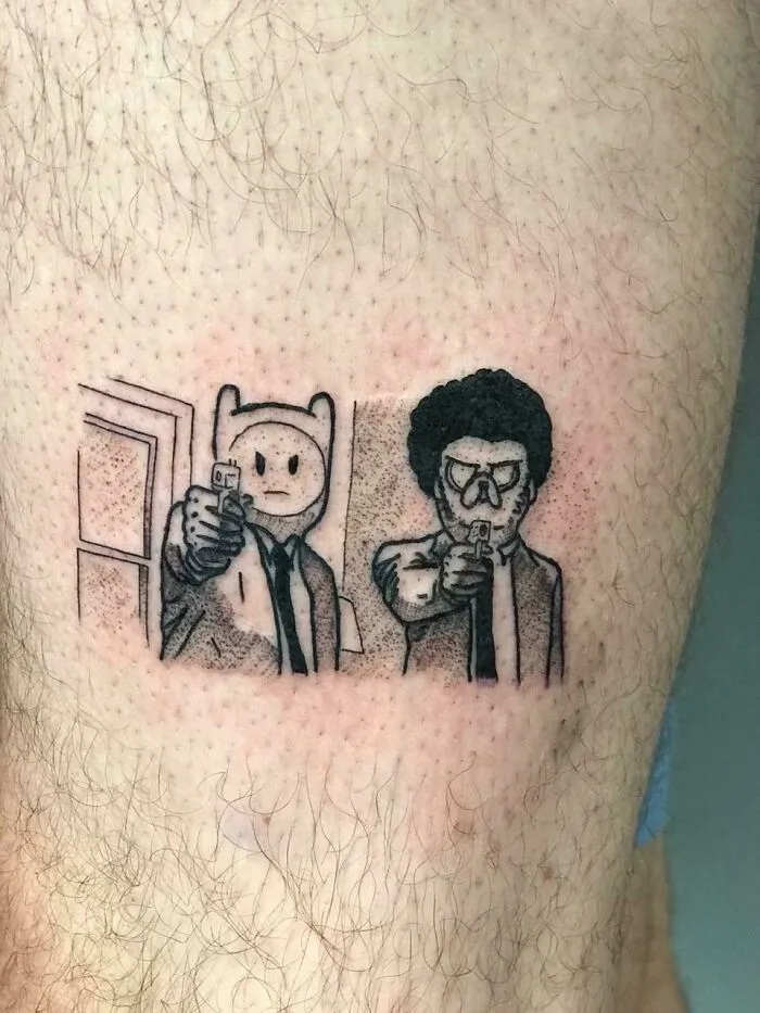 Cartoon tattoo of Pulp Fiction and Adventure Time crossover on skin, combining nostalgic characters in a unique design.