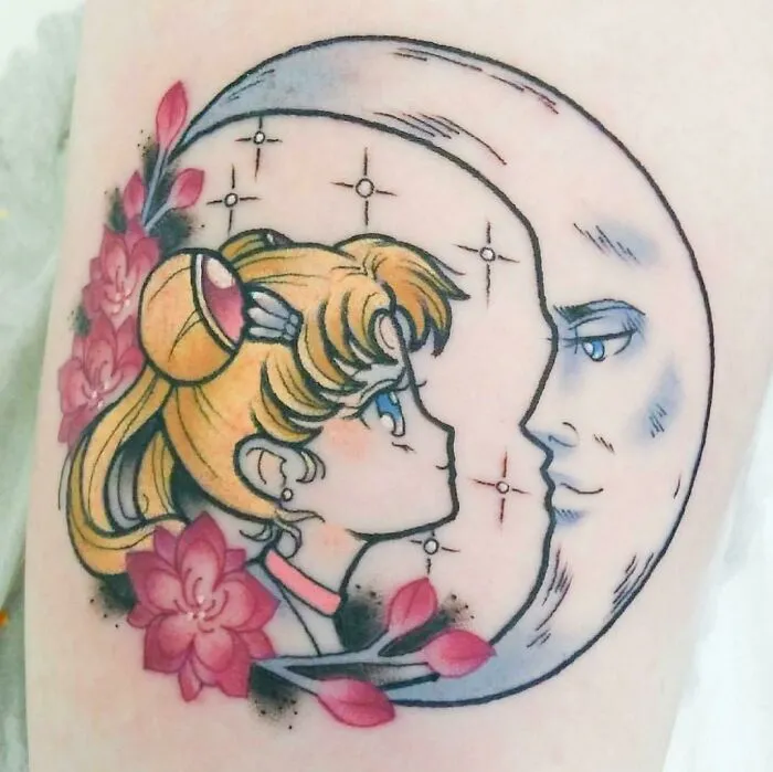 Cartoon tattoo depicting a girl and the moon, inspired by animated shows, with pink flowers and stars around.