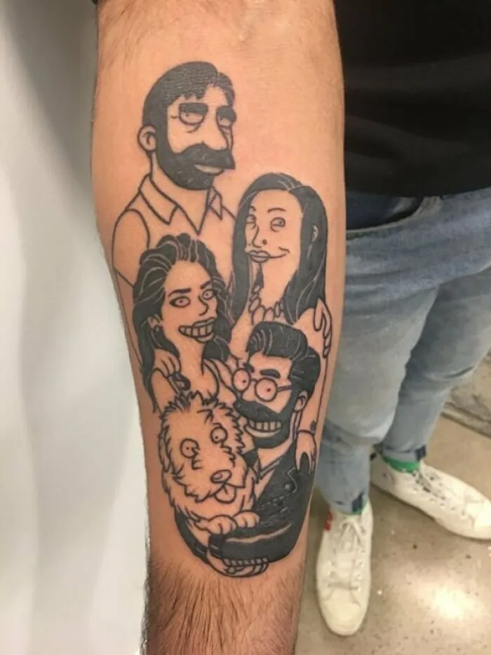Cartoon tattoo featuring characters from popular animated shows on a person's forearm.
