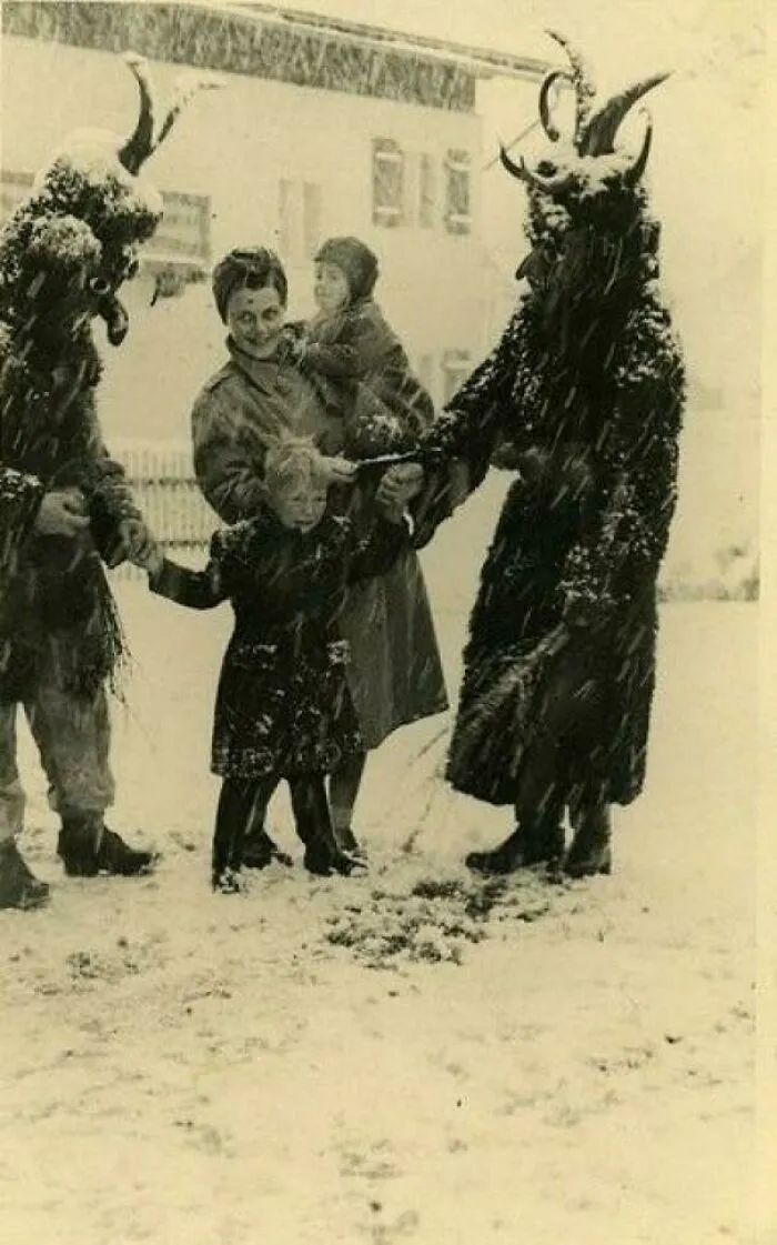 On The Feast Of St. Nicholas In The Town Of Bad Mitterndorf, Austria. St Nicholas Parades Through The Village On A White Horse Followed By The Krampus, Who Warn The Kids To Be Good, Or Else