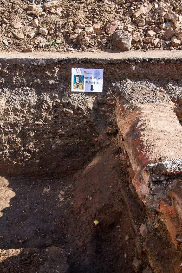 Archaeological dig site marked as Richard III’s burial, revealing historical artifacts.