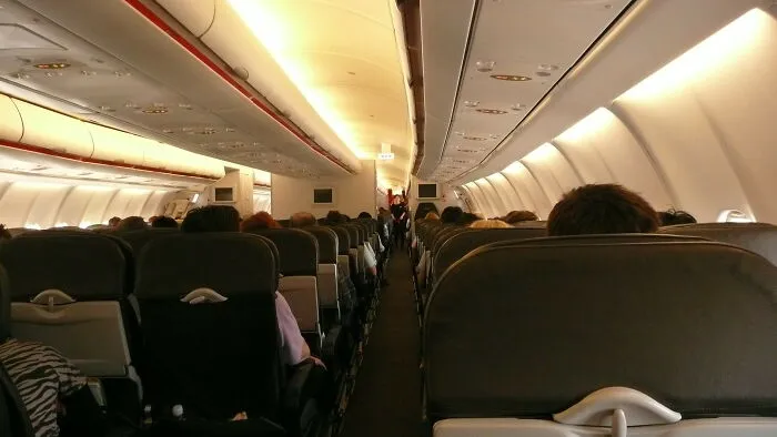 Seat Mate Took Off His Shoes And Spread His Legs Into This Person's Space