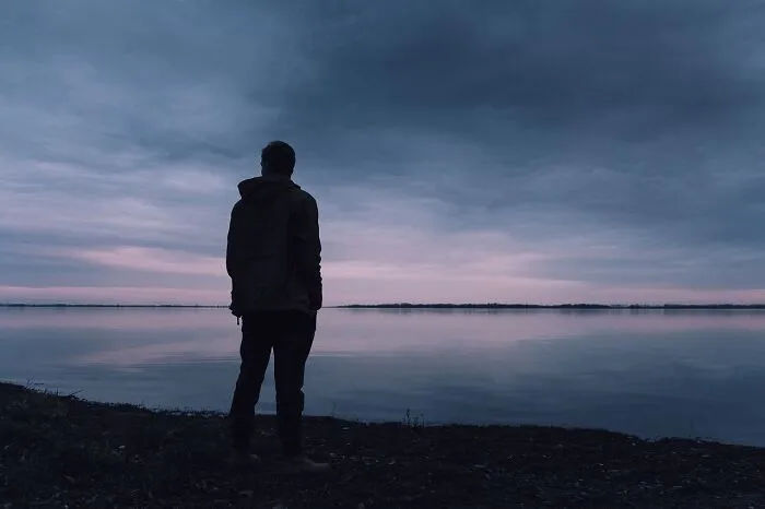 man standing on the shore 