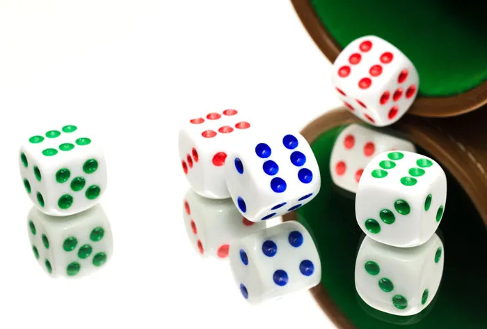 five dices on a mirror surface