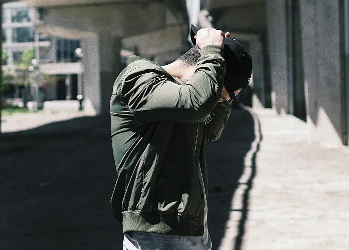 man wearing green jacket 
