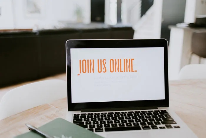Laptop displaying "Join Us Online," suitable for cool New Year's Eve activities from home.