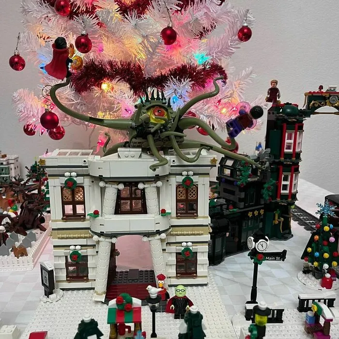 LEGO builds featuring a festive winter village with a Christmas tree and an alien creature on a decorated white tree.