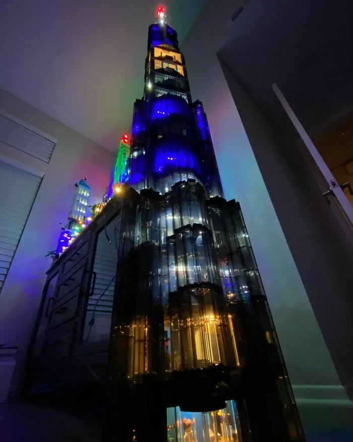 Tall illuminated LEGO build resembling a skyscraper with colorful lights showcasing incredible LEGO builds artistry.