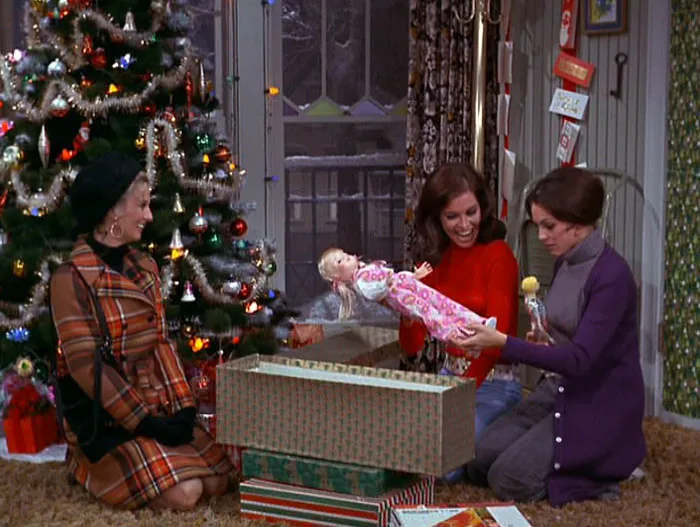 Women opening Christmas gifts 