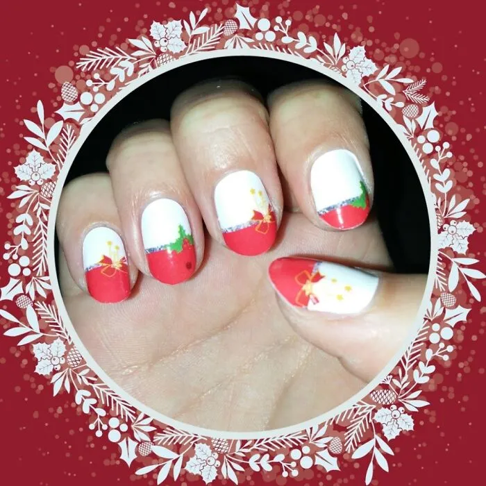 Festive winter nail art featuring red, white, and green designs.